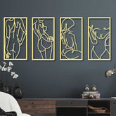 Four gold-framed abstract wall art pieces on a dark blue wall.