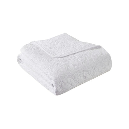 Folded white oversized quilted throw 60x70 made from soft cotton, perfect as a bed comforter for cozy and stylish home décor.