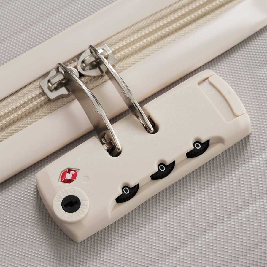 Detailed view of TSA lock on durable lightweight suitcase, offering secure and easy-to-use protection for international travel.