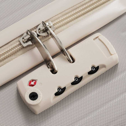 Detailed view of TSA lock on durable lightweight suitcase, offering secure and easy-to-use protection for international travel.