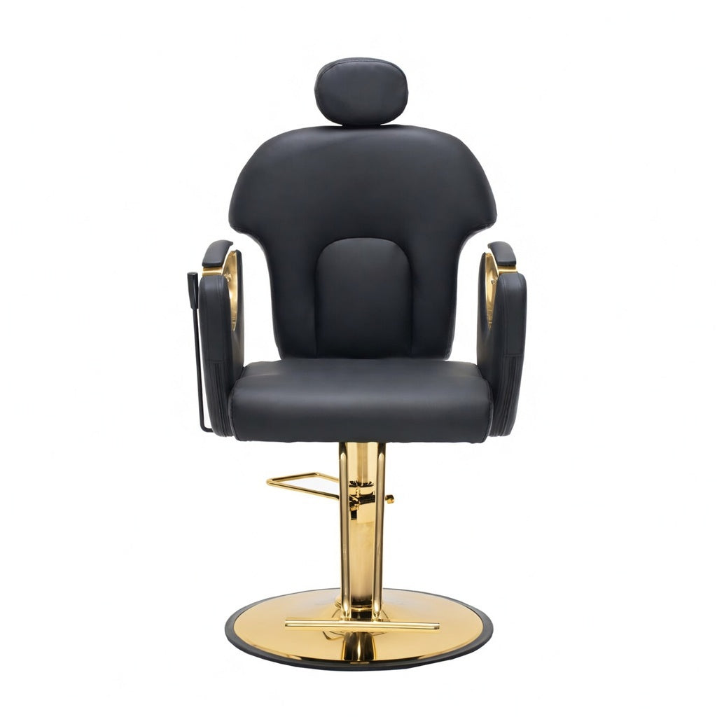 A modern barber chair with black faux leather upholstery and a polished gold metal base, shown against a plain white background.