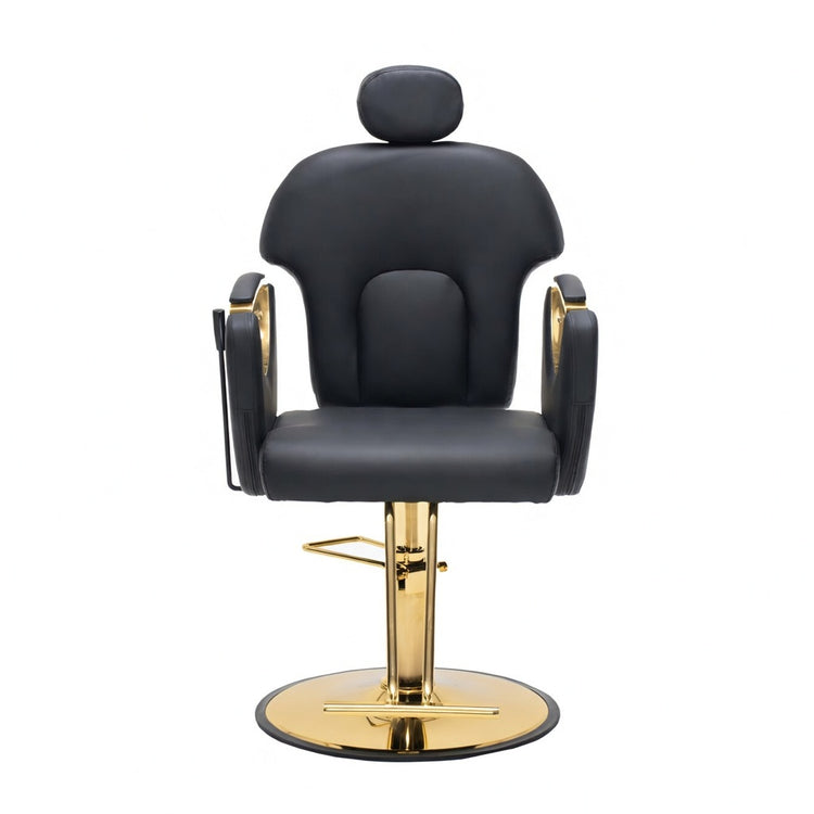 A modern barber chair with black faux leather upholstery and a polished gold metal base, shown against a plain white background.