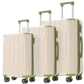 Three-piece softside spinner luggage set in cream with sage green trim, including two handles and four wheels, shown on a white background.