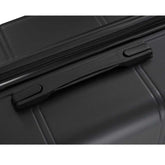 Close-up of a black suitcase with a zipper and handle