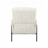 A modern accent chair with a textured, vertically ribbed cream and gray fabric upholstery and slim black metal legs, shown from the back against a plain white background.