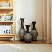 Brown floor vase set of 3 placed beside a bookshelf in a cozy home setting, ideal for stylish home décor accents.