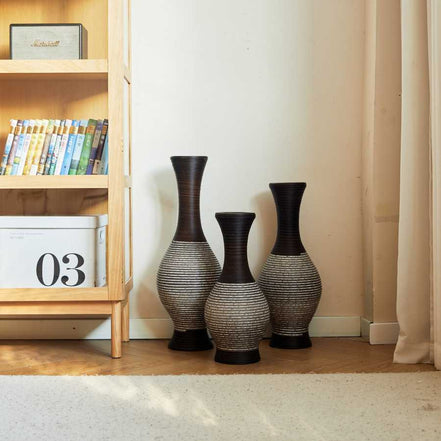 Brown floor vase set of 3 placed beside a bookshelf in a cozy home setting, ideal for stylish home décor accents.