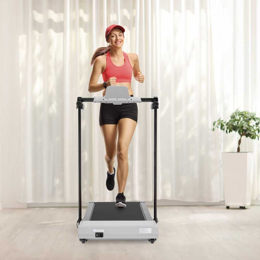 Woman walking on treadmill in home gym