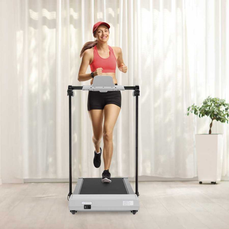 Woman walking on treadmill in home gym