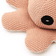 Pink knitted octopus plush toy with black eyes, soft baby-friendly stuffed animal