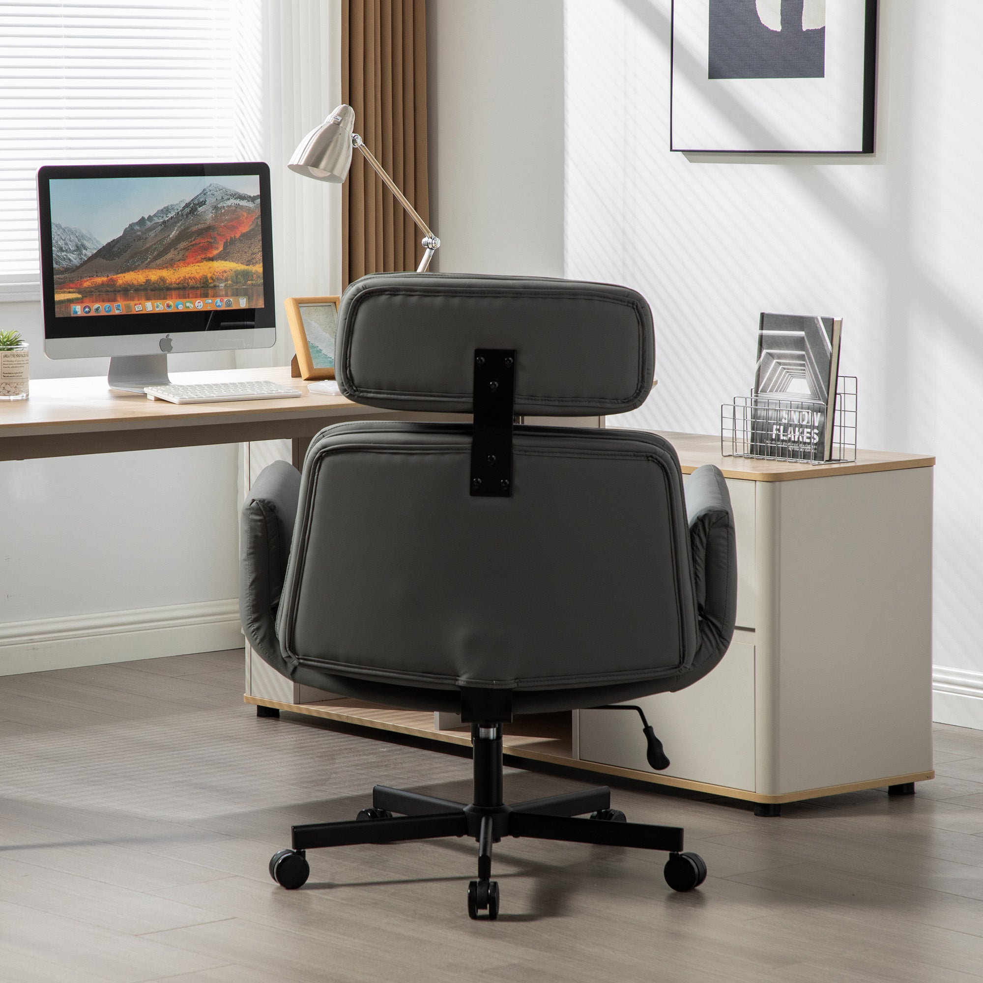 Ergonomic office chair in a modern office setting with a desk and computer.