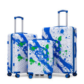 Set of three suitcases with blue and green abstract design on a white background