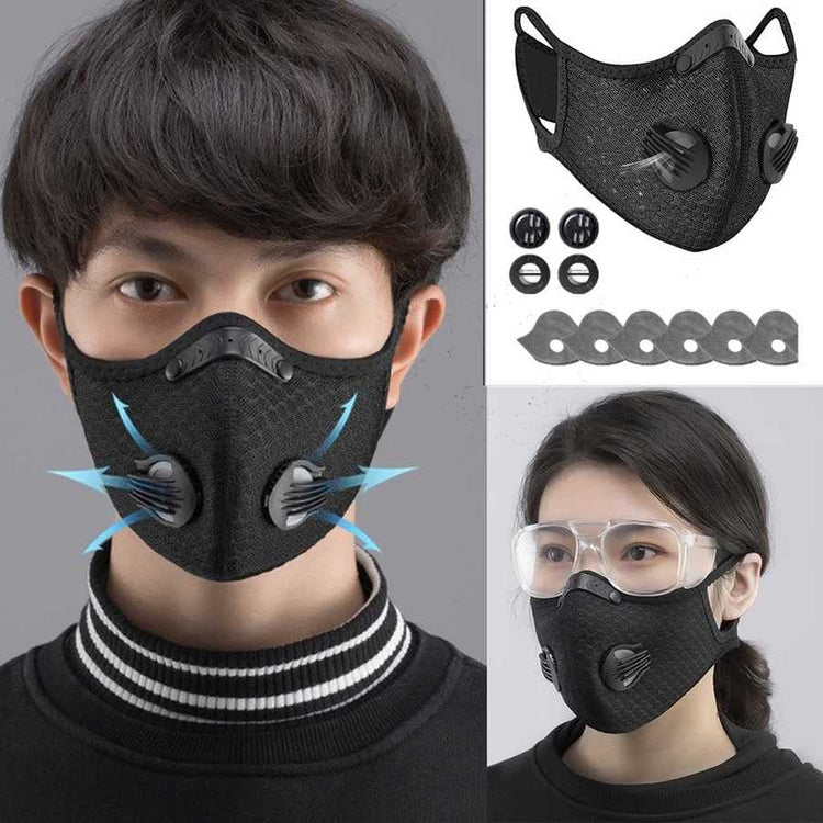 Black face mask with valve on a gray background, additional components shown.