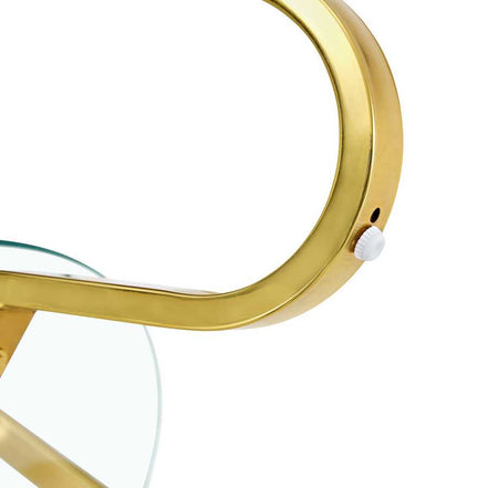 Close-up of Vintage Metal Coffee Table with gold-finished frame and clear glass top. Elegant design ideal for modern living rooms.