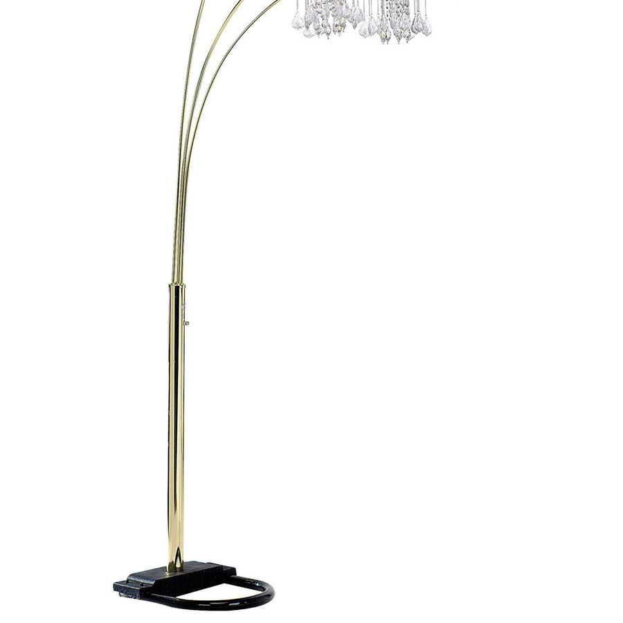 Arc floor lamp with gold base and crystal-like top on a white background
