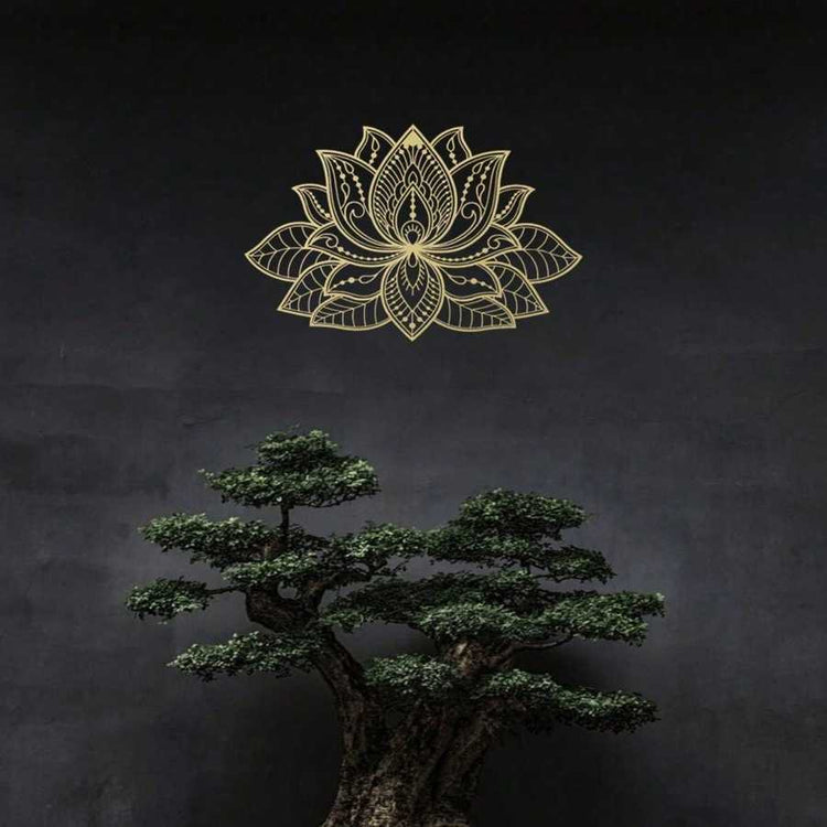 Gold Iron Mandala Lotus Wall Art on a dark wall above a bonsai tree. Complements tranquil, nature-inspired zen decor themes.