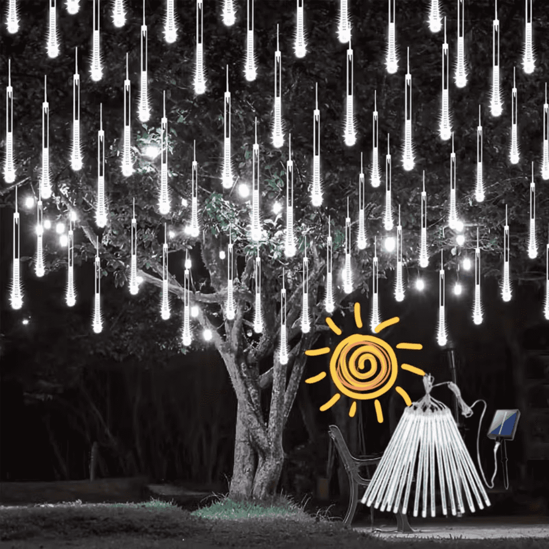 Cool white meteor shower lights hanging from a tree at night, with the solar panel and tubes