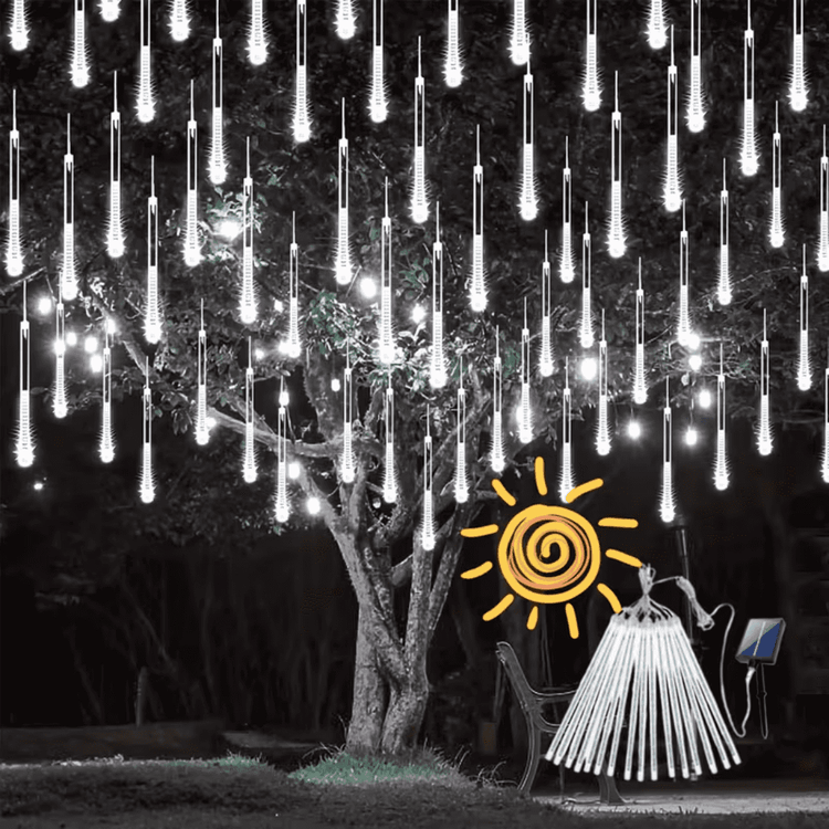 Cool white meteor shower lights hanging from a tree at night, with the solar panel and tubes