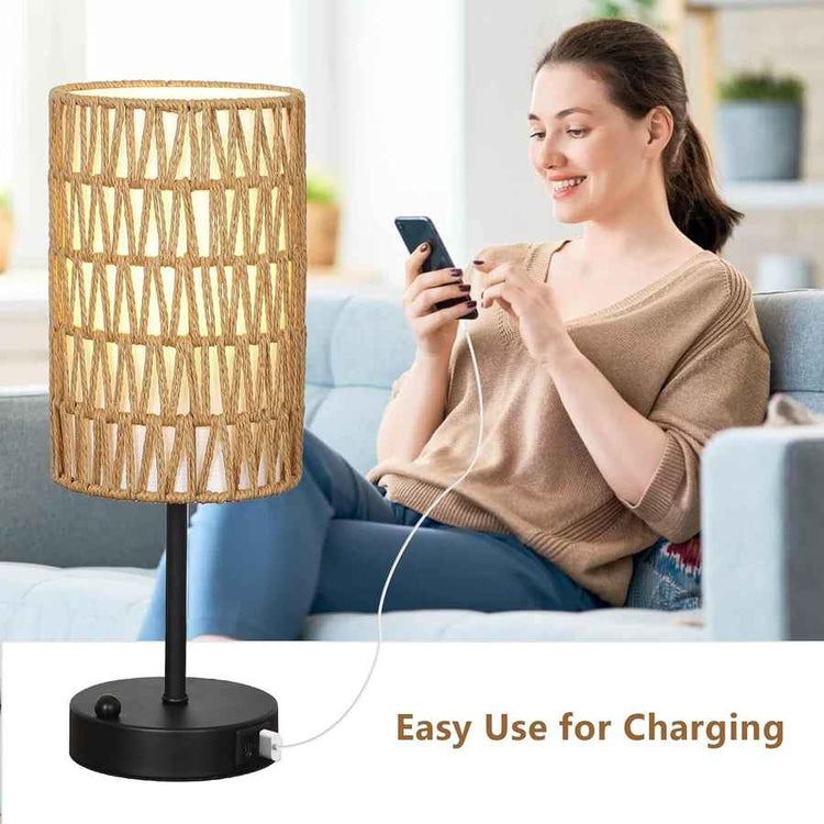 Woman sitting on a couch using a smartphone with a lamp next to her, indicating easy use for charging.