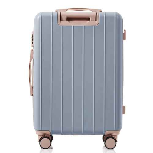Blue suitcase with rose gold handle and wheels on a white background