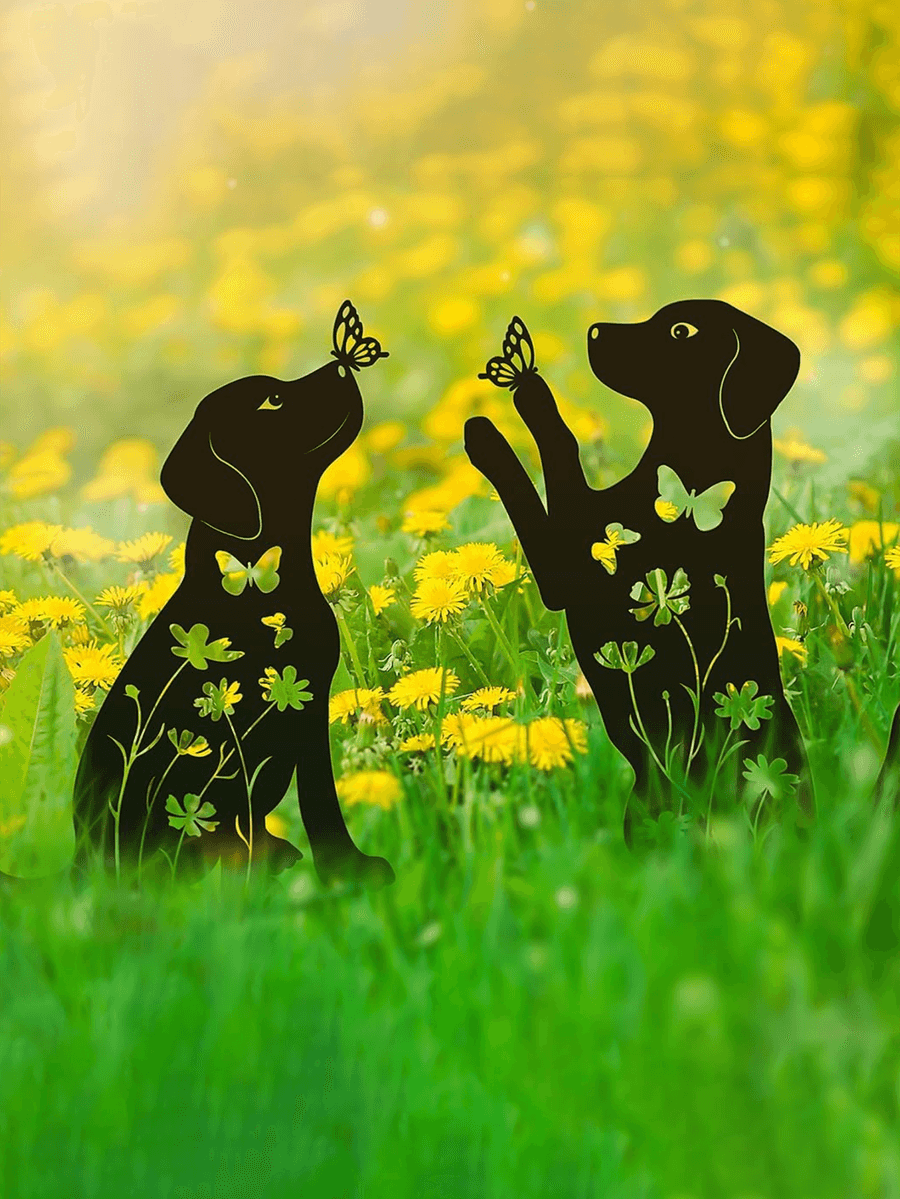 Black silhouette of two dogs with butterflies and flowers in a field of yellow flowers.