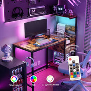 RGB-lit computer desk with remote control, power outlet, and LED modes, perfect for gaming or modern home office setups.