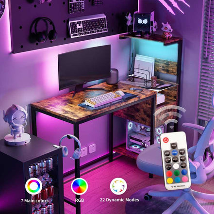 RGB-lit computer desk with remote control, power outlet, and LED modes, perfect for gaming or modern home office setups.