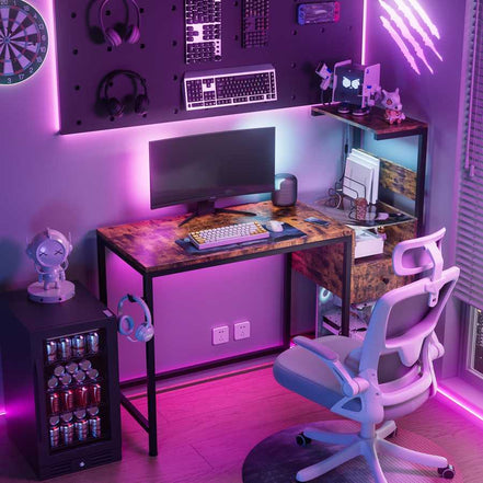 Gaming-inspired home office setup with RGB-lit computer desk, ergonomic chair, and accessories, perfect for tech-savvy users.