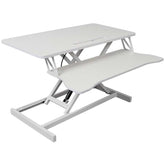 Side view of adjustable standing laptop desk with keyboard tray. Smooth height adjustment mechanism for ergonomic use.