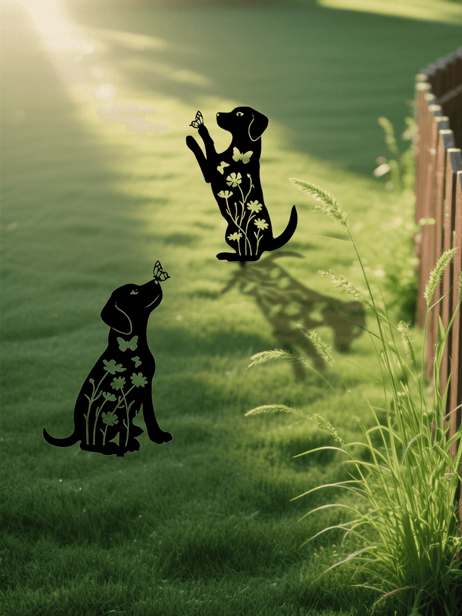Metallic dog-shaped garden stakes with butterfly designs on a grassy area.