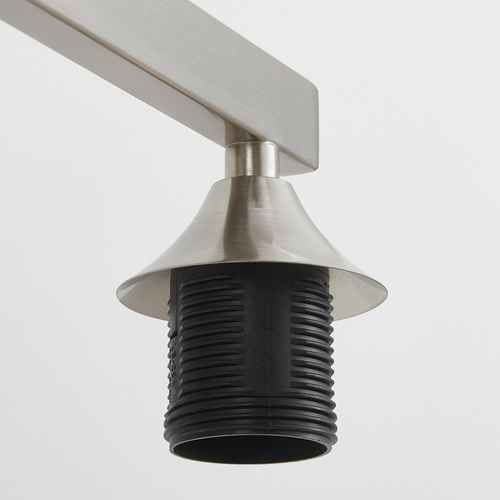 A modern track lighting fixture with a brushed silver metal arm and a black ribbed cylindrical shade, shown against a plain light gray background.