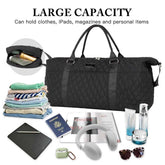 Black quilted duffel bag with travel items on a white background