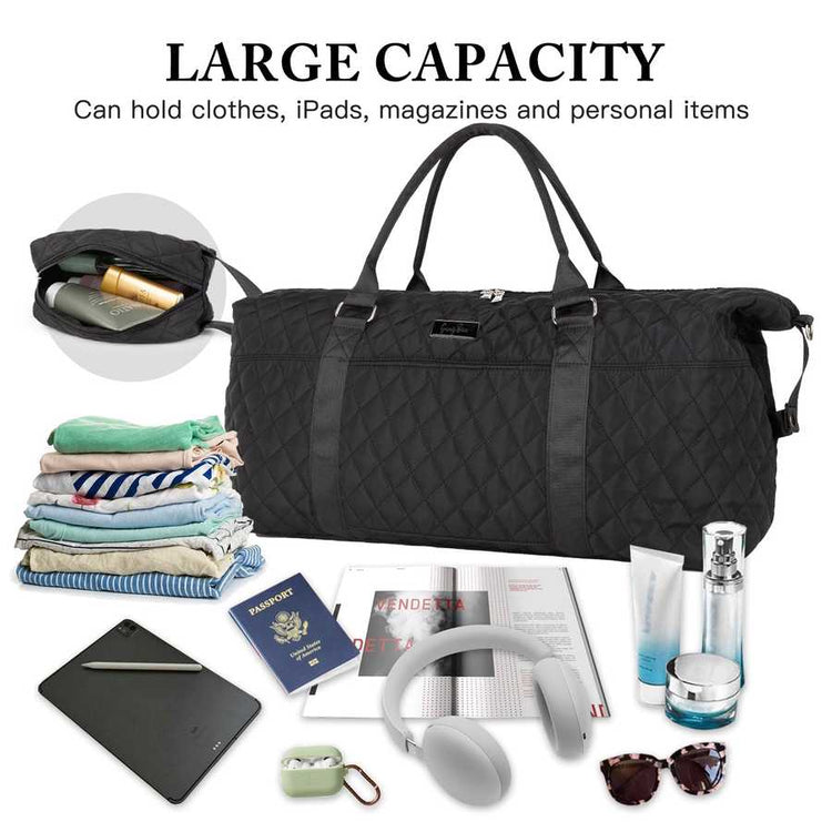 Black quilted duffel bag with travel items on a white background