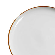 Close-up of ceramic dinner plate from 12 PCS Dinnerware Set for 4, showcasing smooth white surface and elegant golden rim detail.