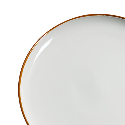 Close-up of ceramic dinner plate from 12 PCS Dinnerware Set for 4, showcasing smooth white surface and elegant golden rim detail.