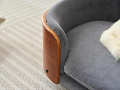 Angled view of plush velvet cushion and curved wood frame on Scandinavian Elevated Dog Bed, perfect for pet luxury.