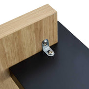 Detail of MDF Coffee Table Modern - Minimalist Design showing metal bracket securing black top to wood base for easy assembly.