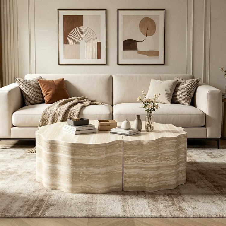 Bright living space with beige sofa, framed artwork, and a marble coffee table, illuminated by natural sunlight.