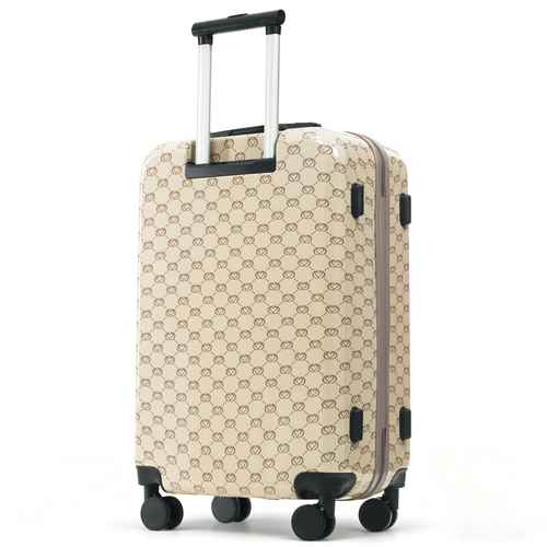 Beige suitcase with a pattern on a white background