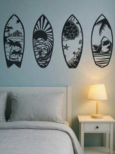 Modern coastal decor featuring metal surfboard wall art above a bed, showcasing ocean waves, palm trees, and marine life silhouettes.