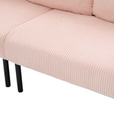 Close-up of a pink ribbed sofa with black legs on a white background