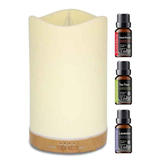 A white and wood diffuser lamp shown on a white background, with three essential oil bottles labeled Sweet Orange, Tea Tree, and Lavender displayed to the right.