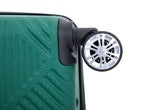Close-up of a green hardshell suitcase with a textured geometric pattern and a black-and-silver spinner wheel on a white background.