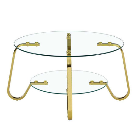 Front view of vintage metal coffee table with clear glass top and shelf, supported by stylish gold legs.