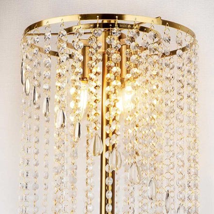 Close-up of gold floor lamp for living room featuring sparkling crystal strands and dual LED bulbs for a luxurious lighting effect.