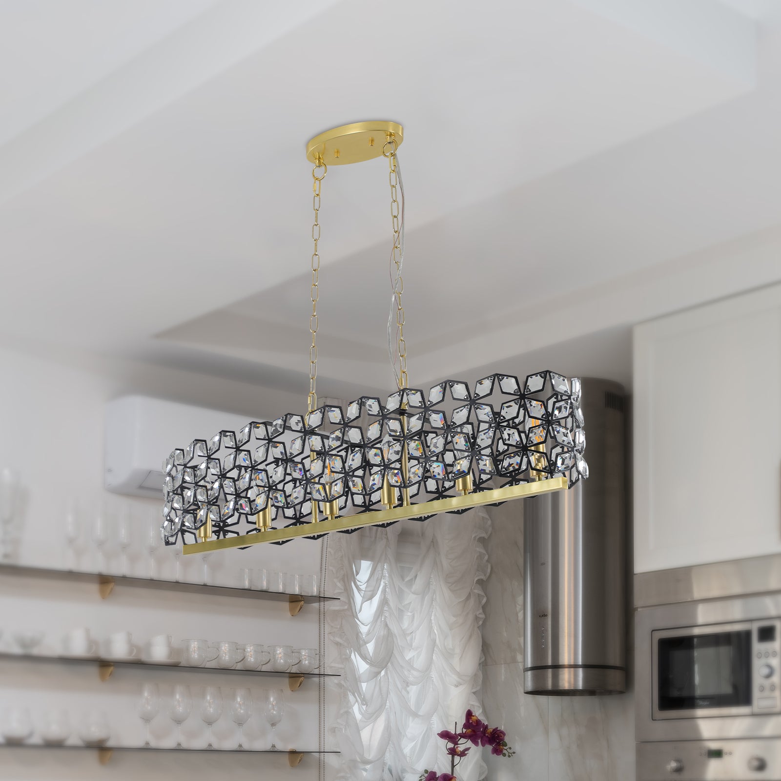 a chandelier hanging from the ceiling in a kitchen