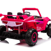 Pink kids ride on car with off-road tires and safety features
