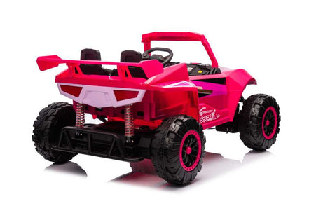 Pink kids ride on car with off-road tires and safety features