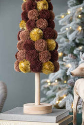 Christmas tree table decor on a wooden stand, close view