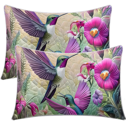 Two decorative pillows with hummingbird and floral design on a white background